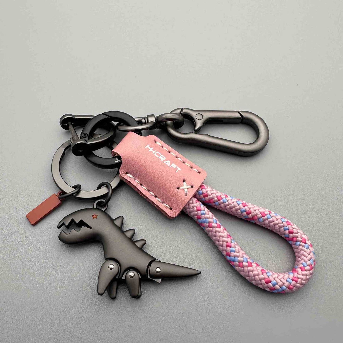 Dinosaurier-Anhänger aus Aluminiumlegierung, kombiniert mit einem handgeflochtenen Armband